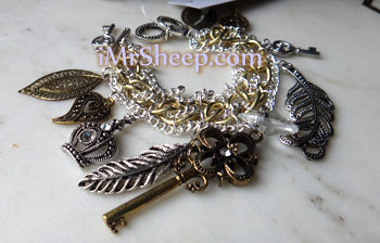 BRACELET WITH CHARMS AND CROWN